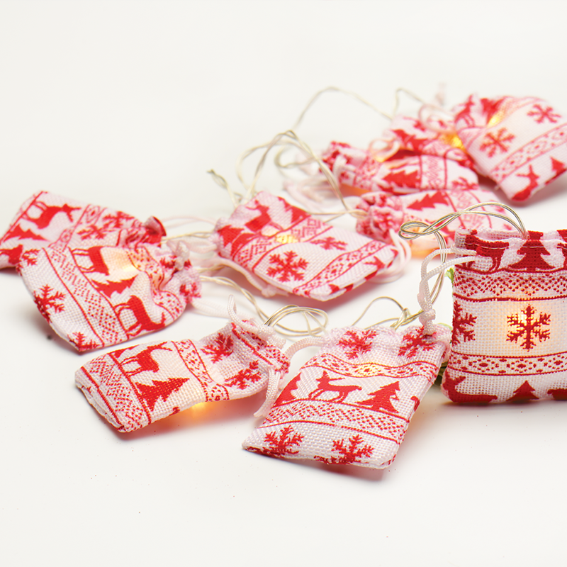 ACA LIGHTING CHRISTMAS XG10WW2A “WOVEN BAG STRING LIGHTS” WHITE & RED BAG 10 LED STRING LIGHTS WITH BATTERIES (2xΑΑ) WARM WHITE IP20 135+30cm TRANSPARENT CABLE